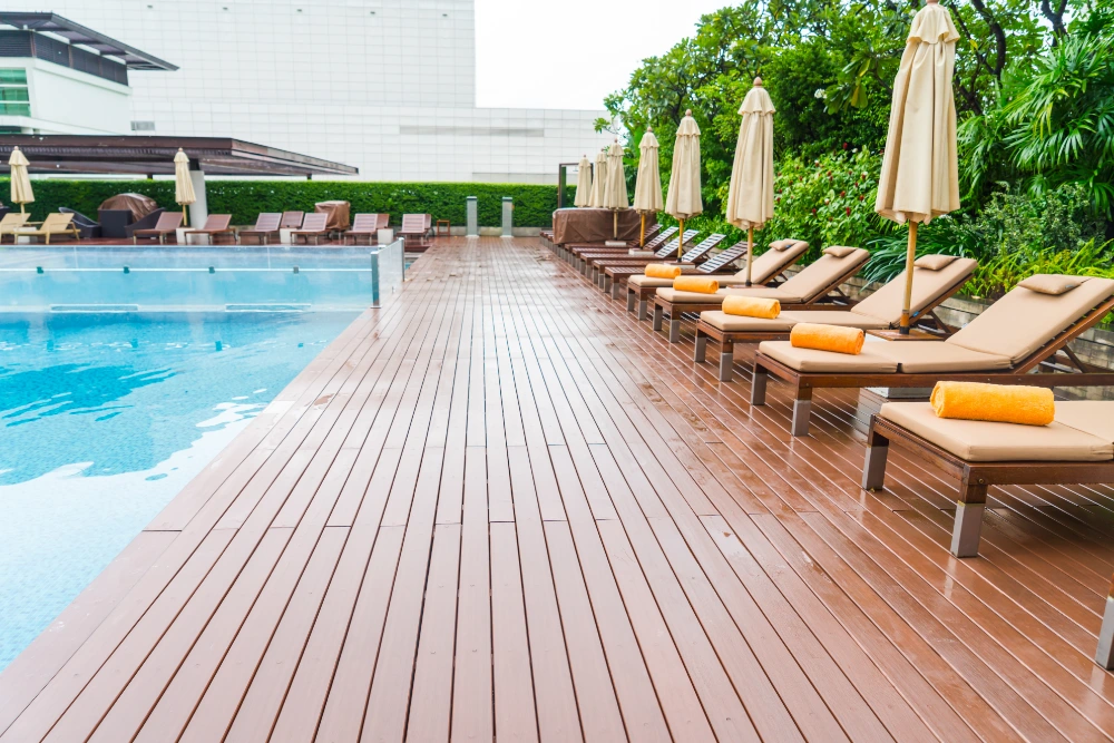 Pool Deck Pressure Washing Professional pressure cleaning Naples FL restoring a residential pool deck by removing algae, mildew, dirt, and surface stains