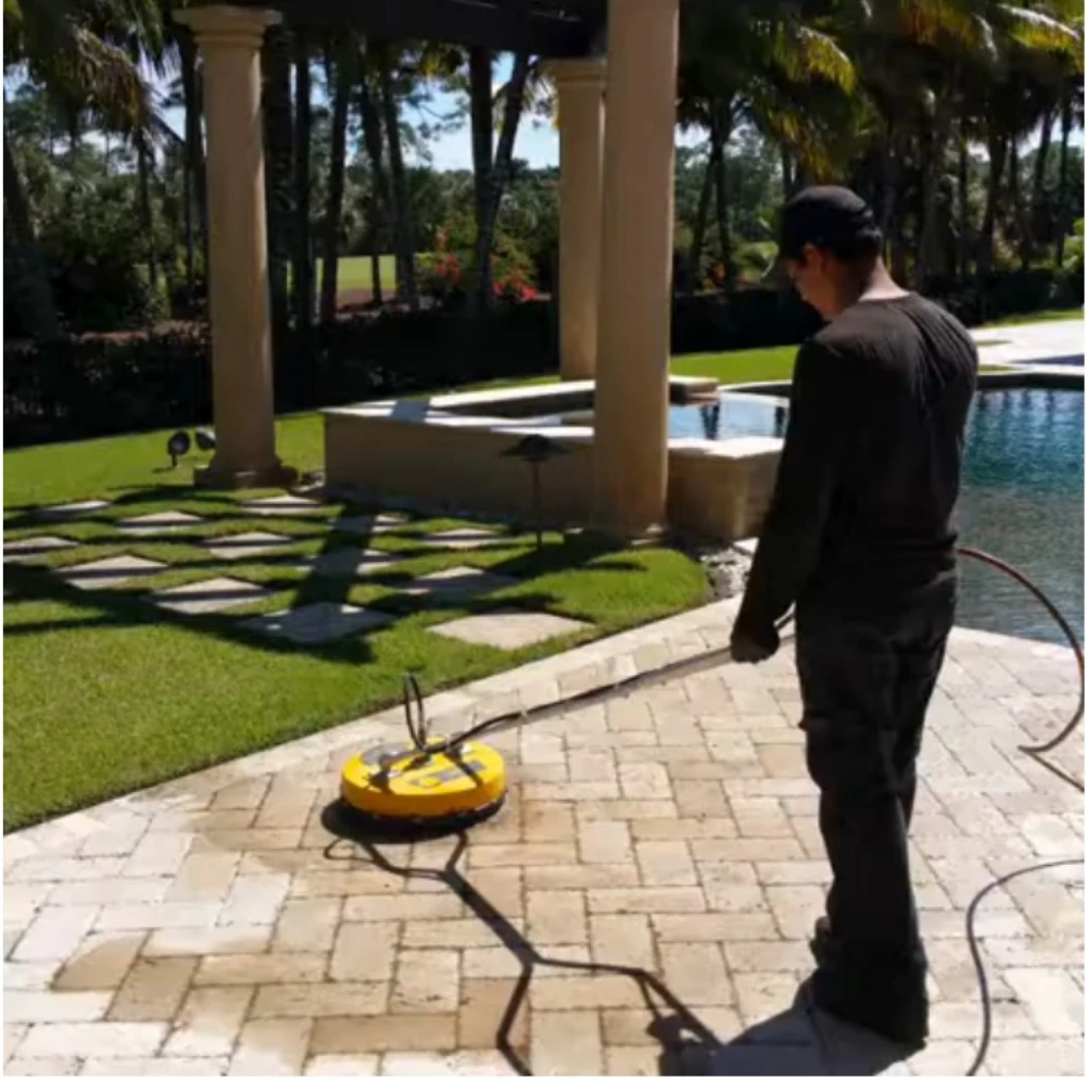 Pressure Cleaning Marco Island FL Local Pressure Cleaning Marco Island FL service cleaning a residential pool deck with a commercial surface cleaner.